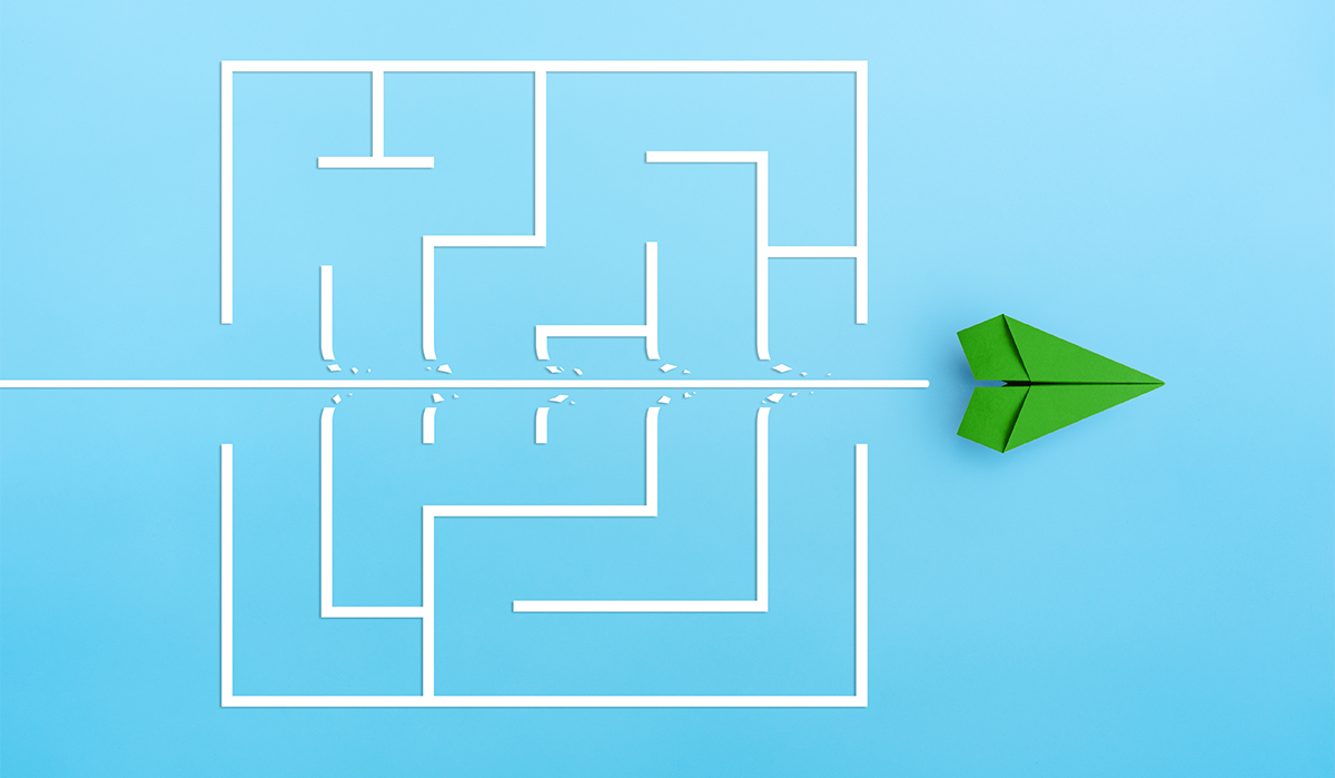 conceptual image of green airplane flying through a maze